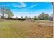 Spacious backyard with room for recreation, surrounded by mature trees and landscaping at 200 Arrowhead Ln, Canton, GA 30114