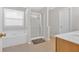 Bright main bathroom with a jetted tub and a separate shower at 200 Arrowhead Ln, Canton, GA 30114