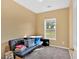 Simple bedroom shows a single window view and a dark futon style couch at 200 Arrowhead Ln, Canton, GA 30114