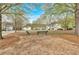 Peaceful community park offering benches for relaxation amidst mature trees and landscaping at 200 Arrowhead Ln, Canton, GA 30114