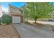 Well-maintained home with a two-car garage, neat landscaping, and inviting driveway at 200 Arrowhead Ln, Canton, GA 30114