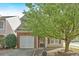 Attractive home with a brick facade, two-car garage, and beautiful mature landscaping at 200 Arrowhead Ln, Canton, GA 30114