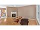 Bright living room featuring a fireplace, wood-look floors, and ample space for entertaining at 200 Arrowhead Ln, Canton, GA 30114