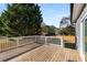 Spacious wood back deck with views of landscaped yard and trees at 221 Silver Springs Sw Cir, Atlanta, GA 30310