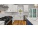 Well-designed kitchen showcasing stainless steel appliances, white cabinetry, and marble countertops at 221 Silver Springs Sw Cir, Atlanta, GA 30310