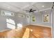 Spacious main bedroom featuring a coffered ceiling, hardwood floors, and large windows at 221 Silver Springs Sw Cir, Atlanta, GA 30310