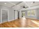 Open main bedroom boasts hardwood floors, a coffered ceiling, and sliding door access at 221 Silver Springs Sw Cir, Atlanta, GA 30310