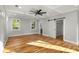 Large main bedroom with a coffered ceiling, hardwood floors, and barn door to closet at 221 Silver Springs Sw Cir, Atlanta, GA 30310