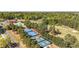 An aerial view of neighborhood tennis courts, pickelball courts, pool and golf course at 3200 Country Club Nw Ct, Kennesaw, GA 30144