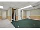 Finished basement with multiple doorways and ample space for recreation or storage at 3200 Country Club Nw Ct, Kennesaw, GA 30144