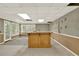Basement featuring a bar, many windows for natural light, and a neutral color palette at 3200 Country Club Nw Ct, Kennesaw, GA 30144