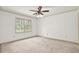 Bedroom with a ceiling fan and a window providing natural light at 3200 Country Club Nw Ct, Kennesaw, GA 30144