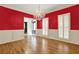 Formal dining room featuring hardwood floors, wainscoting, shutters, and a decorative chandelier at 3200 Country Club Nw Ct, Kennesaw, GA 30144