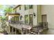 A close-up of the back of the house showing a deck with black metal railings, and entrance door at 3200 Country Club Nw Ct, Kennesaw, GA 30144