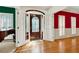 Bright foyer featuring hardwood floors and a decorative front door with sidelight windows at 3200 Country Club Nw Ct, Kennesaw, GA 30144