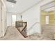 Upstairs hallway with carpet and wrought iron railing at 3200 Country Club Nw Ct, Kennesaw, GA 30144