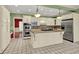 Spacious kitchen with white cabinetry, granite countertops, a large island and stainless steel appliances at 3200 Country Club Nw Ct, Kennesaw, GA 30144