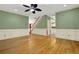 Inviting living room featuring hardwood floors, wainscoting, and stairs to the second floor at 3200 Country Club Nw Ct, Kennesaw, GA 30144