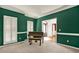 Inviting living room with a piano, shutters, and views through the French doors at 3200 Country Club Nw Ct, Kennesaw, GA 30144