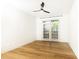 Minimalist bedroom design, complete with a ceiling fan and glass patio doors at 273 12Th Ne St # 114, Atlanta, GA 30309