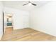 Modern bedroom design highlighting hardwood flooring and an open doorway to a vibrant bathroom at 273 12Th Ne St # 114, Atlanta, GA 30309