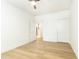 Bedroom with hardwood floors, featuring an open door to a hallway and a closed door at 273 12Th Ne St # 114, Atlanta, GA 30309