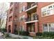 Charming brick apartment building with balconies and well-maintained landscaping at 273 12Th Ne St # 114, Atlanta, GA 30309