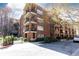 Charming brick apartment building with balconies and well-maintained landscaping at 273 12Th Ne St # 114, Atlanta, GA 30309