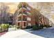 Charming brick condo building with multiple balconies and a well-maintained garden entrance in a desirable neighborhood at 273 12Th Ne St # 114, Atlanta, GA 30309