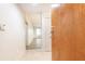 Bright foyer with neutral walls, tile flooring, and a view into the living area through an open doorway at 273 12Th Ne St # 114, Atlanta, GA 30309