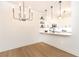Bright kitchen featuring pendant lights, open shelving, and white cabinets at 273 12Th Ne St # 114, Atlanta, GA 30309