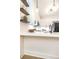 Bright kitchen features quartz countertops, white cabinets, and a black faucet at 273 12Th Ne St # 114, Atlanta, GA 30309