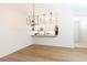Bright kitchen featuring pendant lights, open shelving, and white cabinets at 273 12Th Ne St # 114, Atlanta, GA 30309