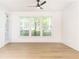 Bright living room with a modern ceiling fan and large windows bringing in lots of natural light at 273 12Th Ne St # 114, Atlanta, GA 30309