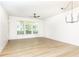 Bright living room with a modern ceiling fan and large windows bringing in lots of natural light at 273 12Th Ne St # 114, Atlanta, GA 30309