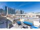City views from rooftop deck with outdoor seating area and blue cushions at 273 12Th Ne St # 114, Atlanta, GA 30309