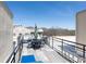 Rooftop deck with an outdoor dining set and seating area, with a view of mature trees at 273 12Th Ne St # 114, Atlanta, GA 30309