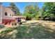 Wide, lush backyard with mature trees and space for recreation at 4172 Whispering Forest Ct, Lilburn, GA 30047