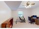 Finished basement area features office space, exercise bike, and ample storage at 4172 Whispering Forest Ct, Lilburn, GA 30047