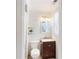 Compact bathroom with a modern vanity, toilet, and shower at 4172 Whispering Forest Ct, Lilburn, GA 30047