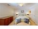 Bedroom with a bright ambiance featuring a queen bed and a neutral decor at 4172 Whispering Forest Ct, Lilburn, GA 30047