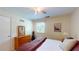 Bright bedroom featuring a dresser, window, and closet at 4172 Whispering Forest Ct, Lilburn, GA 30047