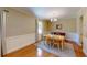 Spacious dining area featuring a wooden table and chairs, complemented by neutral walls and natural light at 4172 Whispering Forest Ct, Lilburn, GA 30047