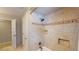 Shower-tub with tile surround and shower head, featuring built-in toiletry shelves at 4172 Whispering Forest Ct, Lilburn, GA 30047