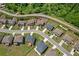 Expansive aerial shot of a suburban neighborhood showcasing well-maintained homes and verdant landscaping at 1645 Dahlia Dr, Cumming, GA 30040