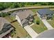 Aerial view of home featuring large front yard and landscaping at 1645 Dahlia Dr, Cumming, GA 30040