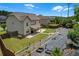 Aerial view of backyard featuring raised garden beds and manicured lawn at 1645 Dahlia Dr, Cumming, GA 30040