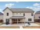 Spacious backyard featuring a covered patio with seating, perfect for outdoor entertaining at 1645 Dahlia Dr, Cumming, GA 30040