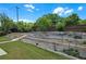 Backyard featuring raised garden beds and manicured lawn at 1645 Dahlia Dr, Cumming, GA 30040