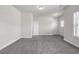 Bedroom offers neutral walls, carpet flooring, bright white trim and a large window at 1645 Dahlia Dr, Cumming, GA 30040